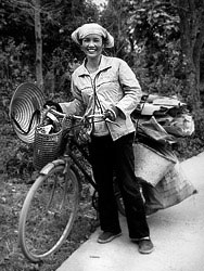 Many people, espescially women, earn their daily living through collecting waste of others. They sell the waste to small dealers, who seperate it and resell it to bigger dealers. I met this women in a small village between Hanoi and Halong City. She was pleased to be photographed, so was I when I saw her natural smile.