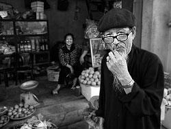In Vietnam many families are earning their income by selling food from their local shop. The shops are often part of the houses in which the families are living.<br><br>I visited this vietnamese family because Chau, who was my local translator, invited me to get to know her village.